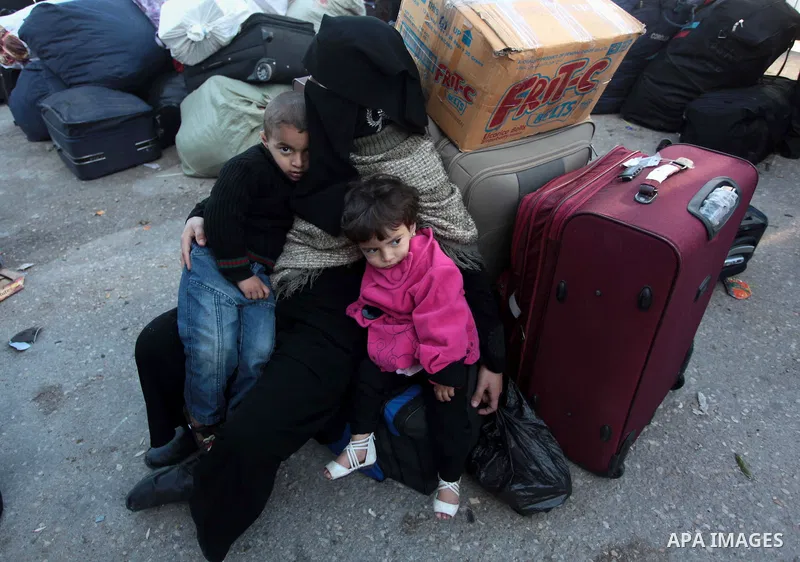Palestinians hoping to cross into Egypt wait at the Rafah crossing between Egypt and the southern Gaza Strip March 31, 2014. Egyptian authorities partially reopened Rafah border crossing, Gaza's main window to the world,...