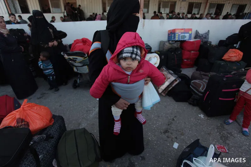 Palestinians hoping to cross into Egypt wait at the Rafah crossing between Egypt and the southern Gaza Strip March 31, 2014. Egyptian authorities partially reopened Rafah border crossing, Gaza's main window to the world,...