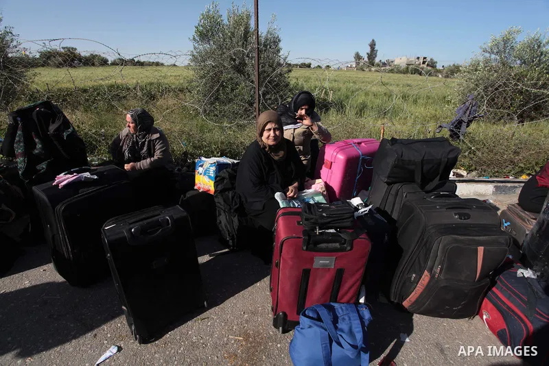 Palestinians hoping to cross into Egypt wait at the Rafah crossing between Egypt and the southern Gaza Strip March 31, 2014. Egyptian authorities partially reopened Rafah border crossing, Gaza's main window to the world,...