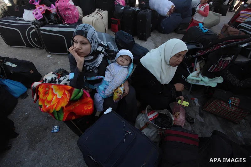 Palestinians hoping to cross into Egypt wait at the Rafah crossing between Egypt and the southern Gaza Strip March 31, 2014. Egyptian authorities partially reopened Rafah border crossing, Gaza's main window to the world,...