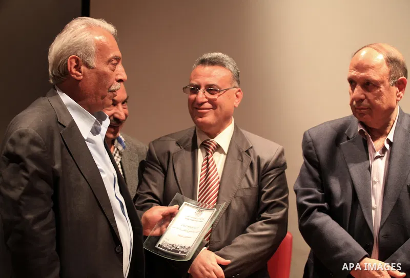 Palestinian journalists attend a ceremony to honor the Jerusalem's journalists and to announce the opening of journalists syndicate, in Jerusalem on March 31, 2014. Photo by Saeed Qaq