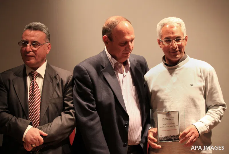 Palestinian journalists attend a ceremony to honor the Jerusalem's journalists and to announce the opening of journalists syndicate, in Jerusalem on March 31, 2014. Photo by Saeed Qaq
