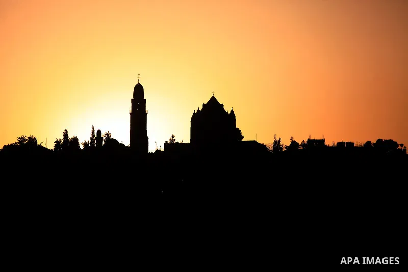 The Church of Zion, also known as the Church of the Apostles is seen during the sunset at the Mount Zion, in Jerusalem's Old City on March 31, 2014. Photo by Saeed Qaq