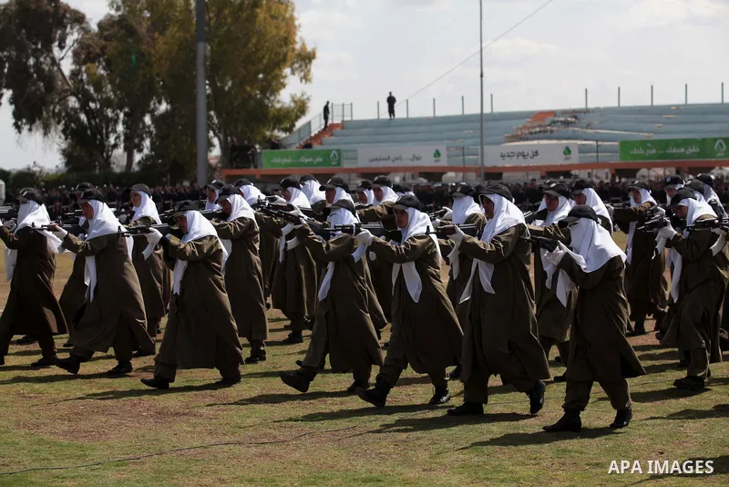 Female members of Palestinian security forces stand during a military graduation ceremony in Gaza City on April 02, 2014. 1200 officers graduated from advanced training courses that lasted one year in Gaza police academy...