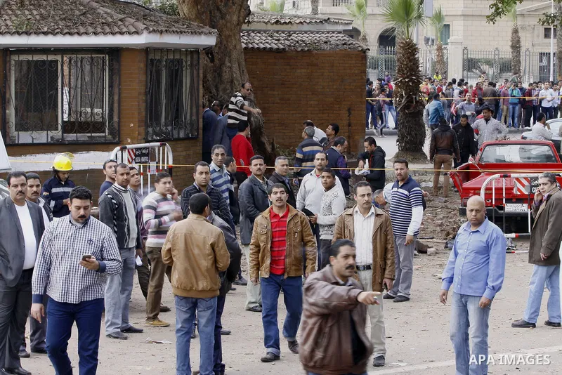 Egyptian security forces inspect the site after multiple explosions hit the area outside the main campus of Cairo University, killing at least two, in Giza, Egypt, Wednesday, April 2, 2014. The bombings targeted riot pol...
