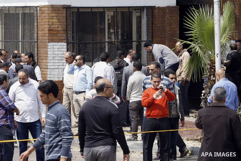 Egyptian security forces inspect the site after multiple explosions hit the area outside the main campus of Cairo University, killing at least two, in Giza, Egypt, Wednesday, April 2, 2014. The bombings targeted riot pol...