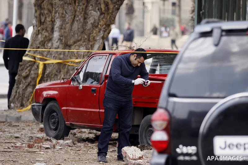 Egyptian security forces inspect the site after multiple explosions hit the area outside the main campus of Cairo University, killing at least two, in Giza, Egypt, Wednesday, April 2, 2014. The bombings targeted riot pol...