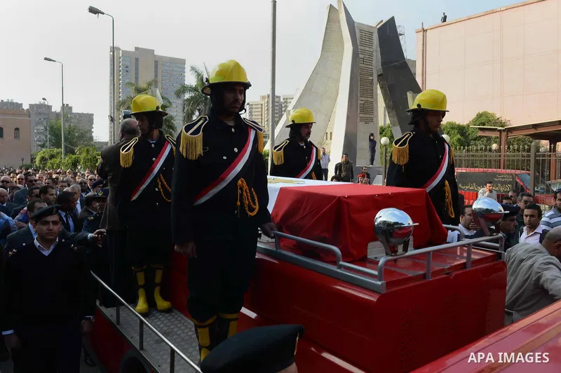 Egyptian security forces carry the coffin of Brigadier Tareq al-Margawi, who was killed in a bombing earlier in the day, during his funeral in Cairo, Egypt, 02 April 2014. Brigadier Tareq al-Margawi, the chief of a polic...