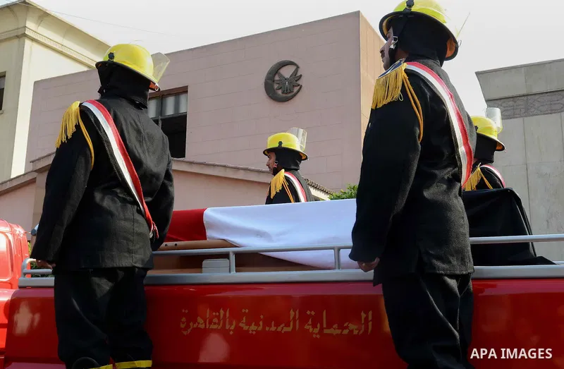 Egyptian security forces carry the coffin of Brigadier Tareq al-Margawi, who was killed in a bombing earlier in the day, during his funeral in Cairo, Egypt, 02 April 2014. Brigadier Tareq al-Margawi, the chief of a polic...