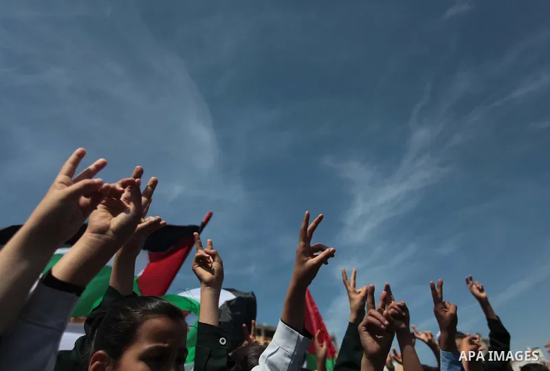 Palestinian children take part in a rally marking the Children's Day during a protest against Israeli blockade on Gaza strip in Gaza city, on April 05, 2014. Photo by Ashraf Amra