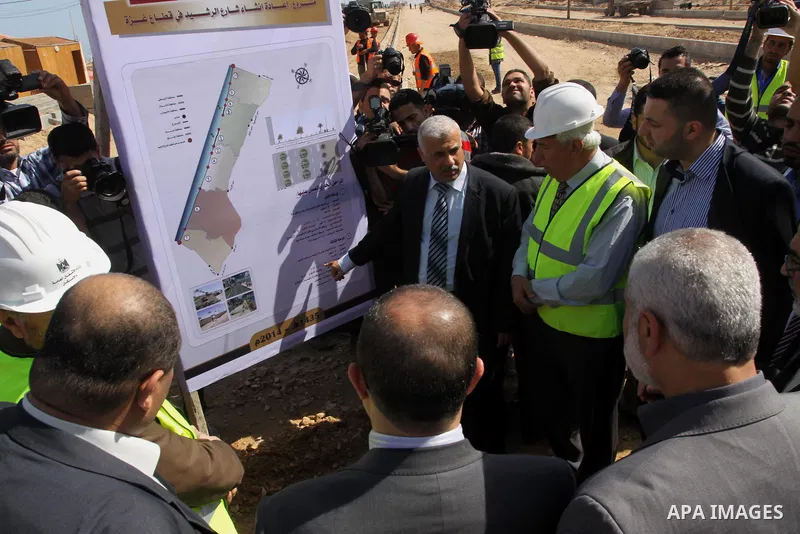 Palestinian Prime Minister in Gaza Strip Ismail Haniyeh, visits the construction site of al-Rasheed Road, in Gaza City, April 16, 2014. Qatar funds several large economic projects in Gaza Strip ruled by Hamas, with the t...