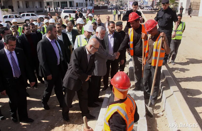 Palestinian Prime Minister in Gaza Strip Ismail Haniyeh, visits the construction site of al-Rasheed Road, in Gaza City, April 16, 2014. Qatar funds several large economic projects in Gaza Strip ruled by Hamas, with the t...