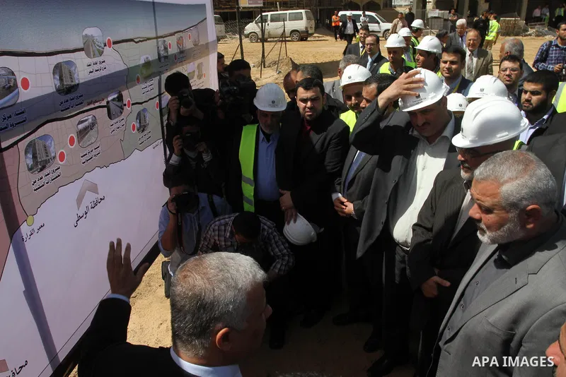 Palestinian Prime Minister in Gaza Strip Ismail Haniyeh, visits the construction site of al-Rasheed Road, in Gaza City, April 16, 2014. Qatar funds several large economic projects in Gaza Strip ruled by Hamas, with the t...