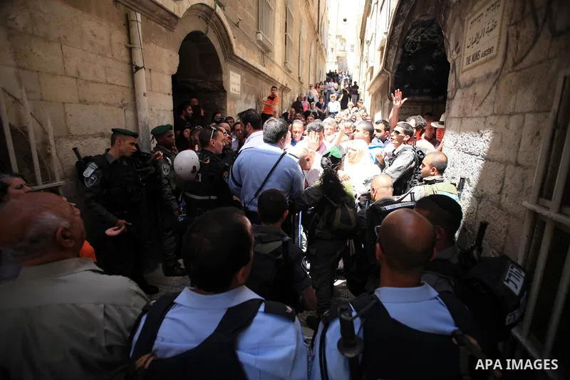 Israeli policemen prevent Palestinians from entering the Al-Aqsa mosque compound in the Old City of Jerusalem on April 18, 2014. Israeli authorities on Friday prevented Palestinians, who are less than 50 years old, from...
