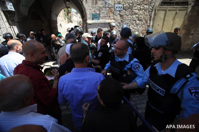 Israeli policemen prevent Palestinians from entering the Al-Aqsa mosque compound in the Old City of Jerusalem on April 18, 2014. Israeli authorities on Friday prevented Palestinians, who are less than 50 years old, from...