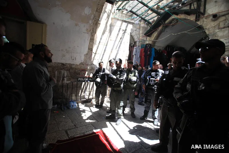 Palestinian muslims pray in front of Israeli policemen as they prevent them from entering the Al-Aqsa mosque compound, in the Old City of Jerusalem on April 18, 2014. Israeli authorities on Friday prevented Palestinians,...