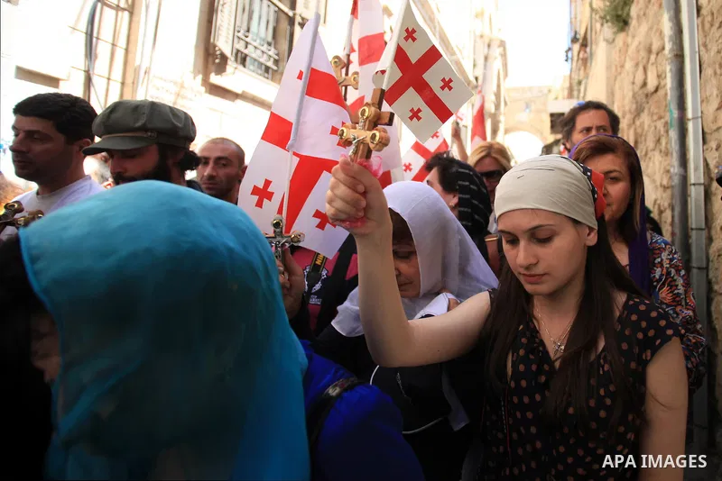 Christian Orthodox pilgrims participate in a procession marking Good Friday on April 18, 2014 in Jerusalem's old city. Thousands of Christian pilgrims take part in processions along the route where, according to traditio...