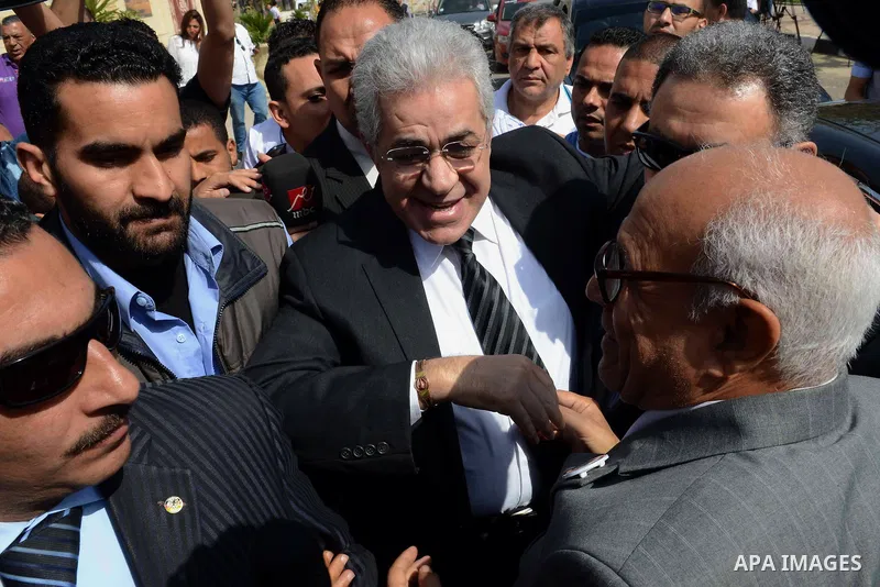 Egyptian presidential hopeful Hamdeen Sabahy waves to supporters as he arrives to formally submit the documents required for his presidential candidacy to Egyptian presidential elections commission, in Cairo, Egypt, 19 A...