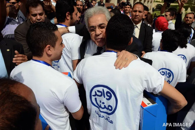 Egyptian presidential hopeful Hamdeen Sabahy waves to supporters as he arrives to formally submit the documents required for his presidential candidacy to Egyptian presidential elections commission, in Cairo, Egypt, 19 A...