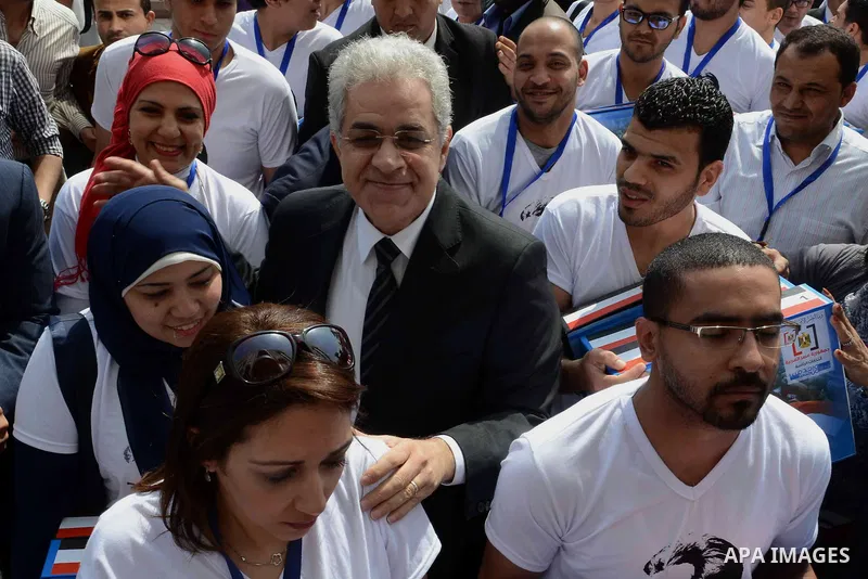 Egyptian presidential hopeful Hamdeen Sabahy waves to supporters as he arrives to formally submit the documents required for his presidential candidacy to Egyptian presidential elections commission, in Cairo, Egypt, 19 A...