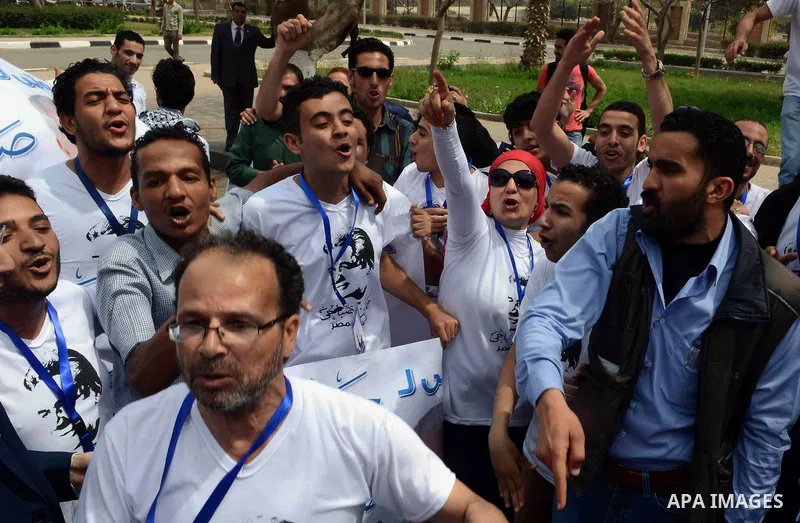 Campaign volunteers of presidential hopeful Hamdeen Sabahi, carry boxes containing thousands of endorsements at the election commission office in Cairo, Egypt, Saturday, April 19, 2014. It is mandatory for any presidenti...