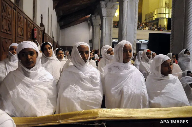 Egyptian Christians attend the ceremony of 'Holy Saturday', believed as holy and a day before the Easter according to Orthodox Christianity,led by Pope Tawadros II on April 19, 2014 in Cairo, Egypt. Photo by Mohammed Ben...