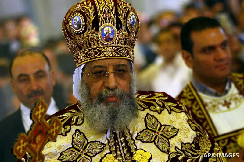 Pope Tawadros II, leader of Egypt's Coptic Church, leads an Easter service late on April 19, 2014 at the Cathedral of Abbasiya in Cairo. Copts account for six to 10 percent of Egypt's 85 million people. Photo by Mohammed...