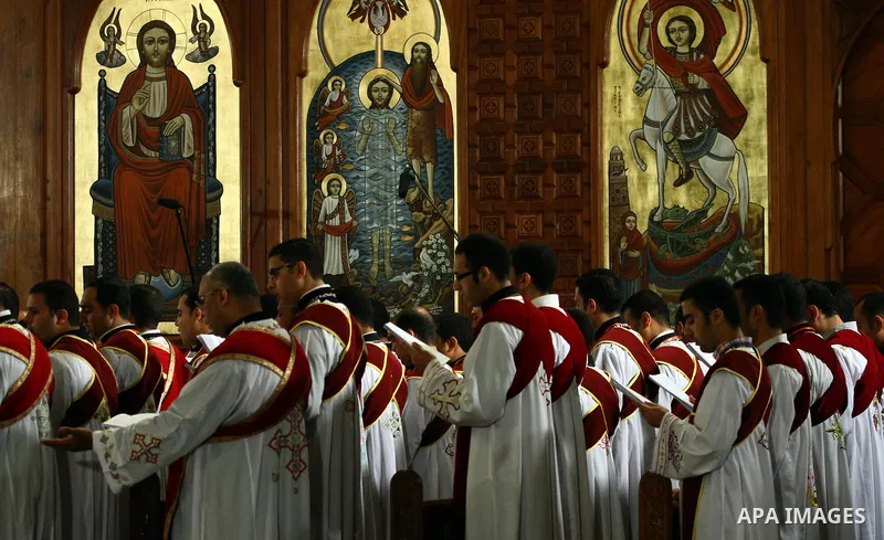 Egyptian Christians attend the ceremony of 'Holy Saturday', believed as holy and a day before the Easter according to Orthodox Christianity,led by Pope Tawadros II on April 19, 2014 in Cairo, Egypt. Photo by Mohammed Ben...