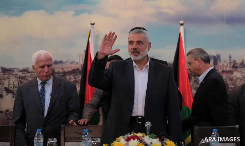 Palestinian leaders of Hamas movement and members of PLO delegation attend the reconciliation meeting in Gaza City on April 23, 2014. Rival Palestinian leaders from the West Bank and Gaza Strip agreed to form a unity gov...