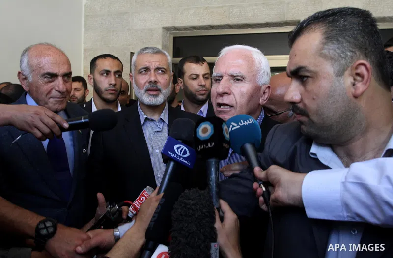 Palestinian Fatah delegation chief Azzam al-Ahmed speaks to media following a meeting with Prime Minister in Gaza Strip Ismail Haniya the day after rival Palestinian leaders from the West Bank and Gaza Strip agreed to fo...