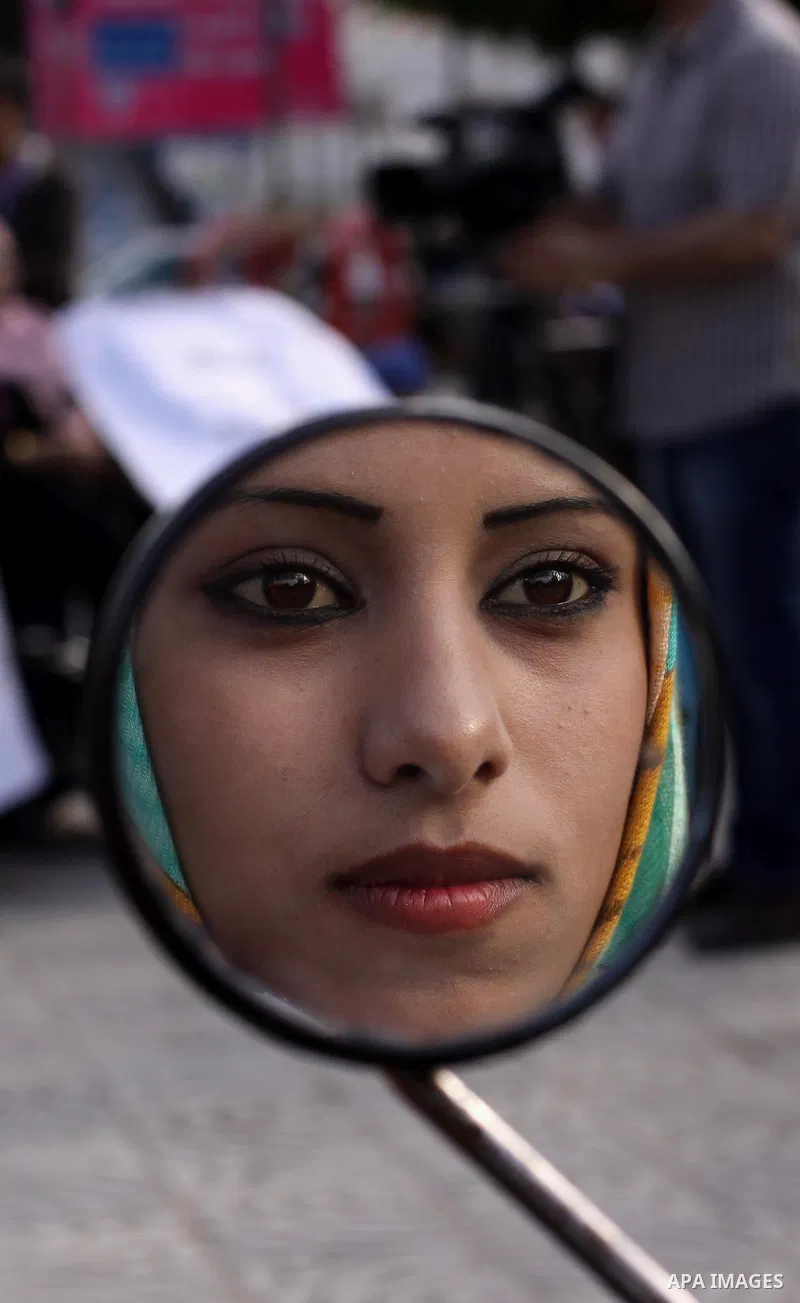 Palestinians with special needs take part in celebrate the agreement to form a unity government in Gaza city on April 24, 2014. The agreement was reached on April 23, in talks in Gaza City which continued into the early...