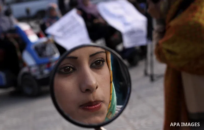 Palestinians with special needs take part in celebrate the agreement to form a unity government in Gaza city on April 24, 2014. The agreement was reached on April 23, in talks in Gaza City which continued into the early...