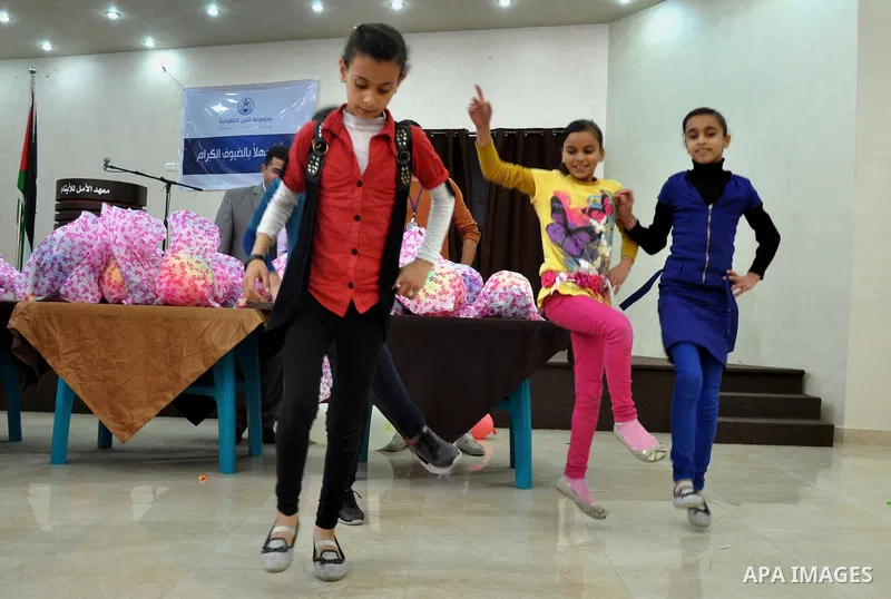 Palestinian orphans participate in a celebration in Gaza city on April 26, 2014. Photo by Mohammed Talatene