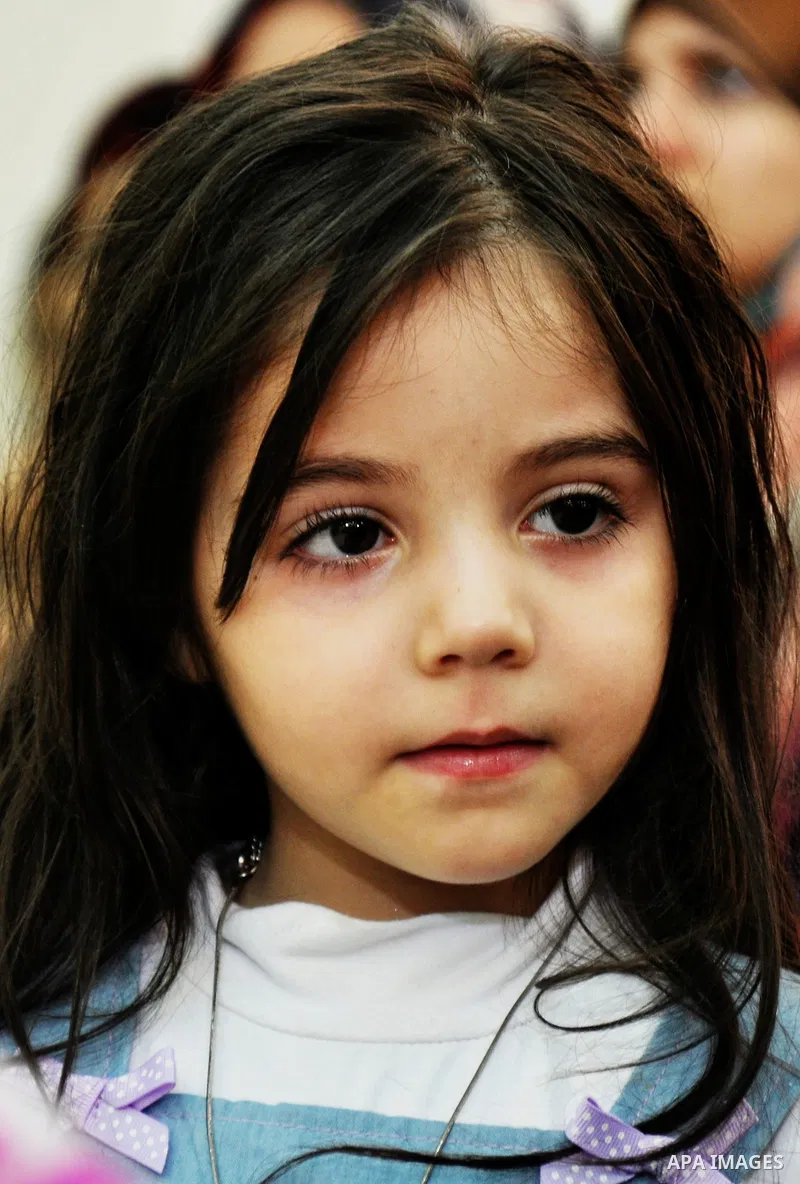 Palestinian orphans participate in a celebration in Gaza city on April 26, 2014. Photo by Mohammed Talatene
