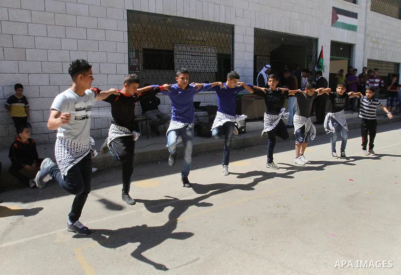 Palestinian children participate in the open day at school in the West Bank city of Nablus on April 27, 2014. Photo by Nedal Eshtayah