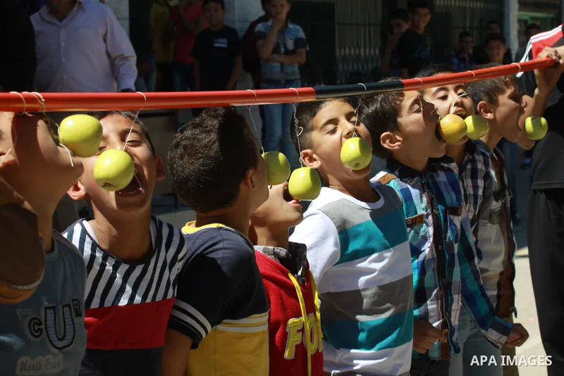 Palestinian children participate in the open day at school in the West Bank city of Nablus on April 27, 2014. Photo by Nedal Eshtayah