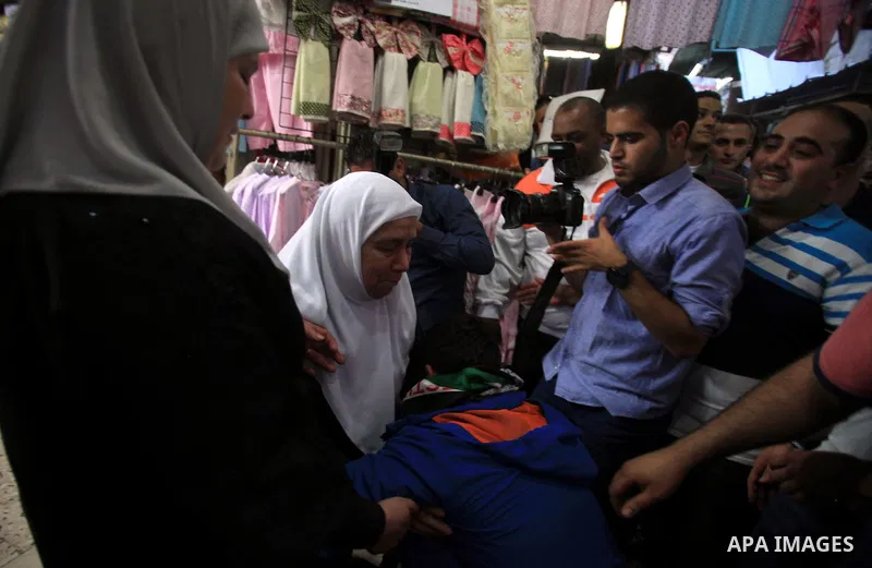 Palestinians celebrate the release of protesters detained by Israeli police during recent clashes at the Al-Aqsa mosque compound on April 27, 2014 in the Old City of Jerusalem. Israeli police arrested 16 Palestinians las...