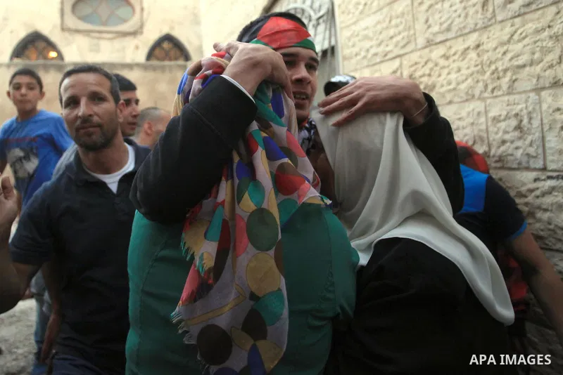 Palestinians celebrate the release of protesters detained by Israeli police during recent clashes at the Al-Aqsa mosque compound on April 27, 2014 in the Old City of Jerusalem. Israeli police arrested 16 Palestinians las...
