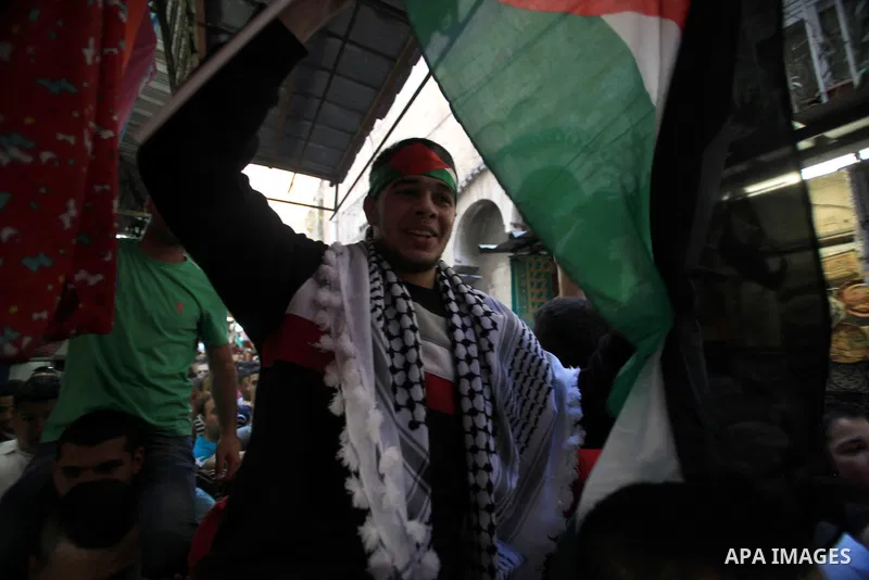 Palestinians celebrate the release of protesters detained by Israeli police during recent clashes at the Al-Aqsa mosque compound on April 27, 2014 in the Old City of Jerusalem. Israeli police arrested 16 Palestinians las...