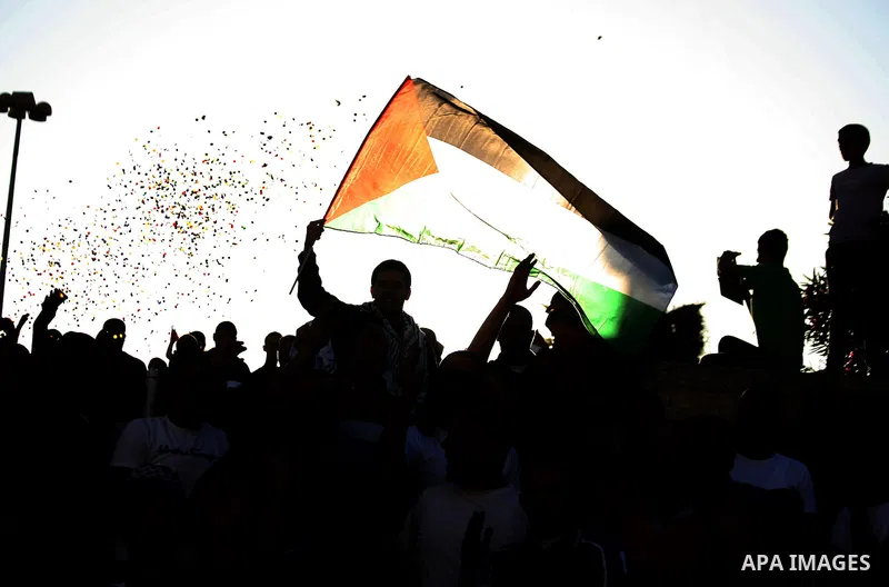 Palestinians celebrate the release of protesters detained by Israeli police during recent clashes at the Al-Aqsa mosque compound on April 27, 2014 in the Old City of Jerusalem. Israeli police arrested 16 Palestinians las...