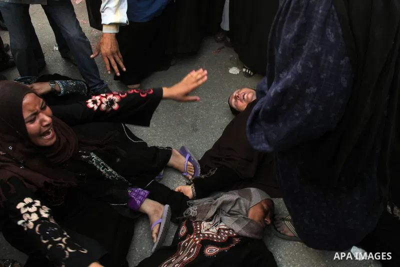 Relatives and families of members of Muslim Brotherhood and supporters of ousted President Mohamed Mursi react after hearing the sentence, in front of the court in Minya, south of Cairo, April 28, 2014. An Egyptian court...