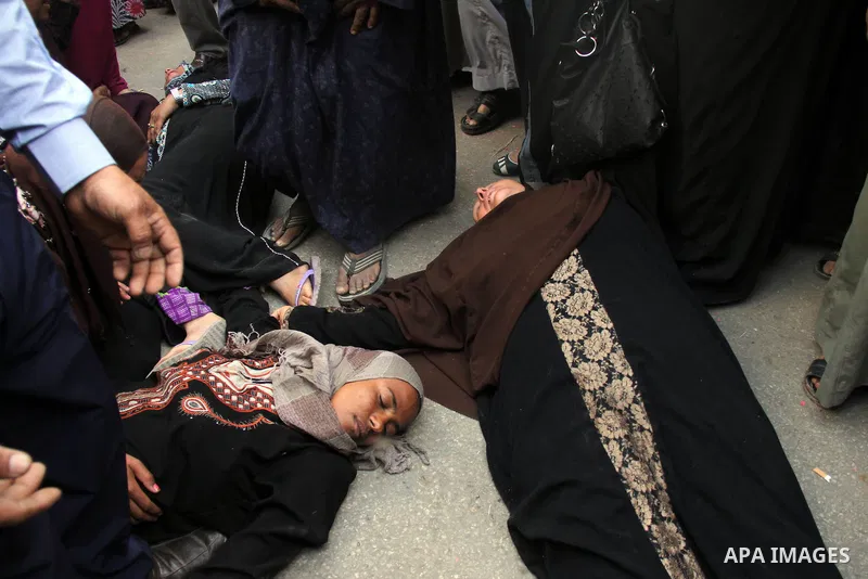 Relatives and families of members of Muslim Brotherhood and supporters of ousted President Mohamed Mursi react after hearing the sentence, in front of the court in Minya, south of Cairo, April 28, 2014. An Egyptian court...