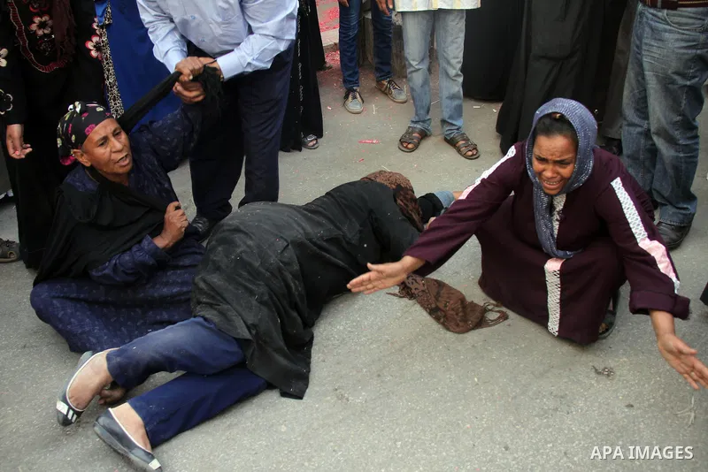 Relatives and families of members of Muslim Brotherhood and supporters of ousted President Mohamed Mursi react after hearing the sentence, in front of the court in Minya, south of Cairo, April 28, 2014. An Egyptian court...