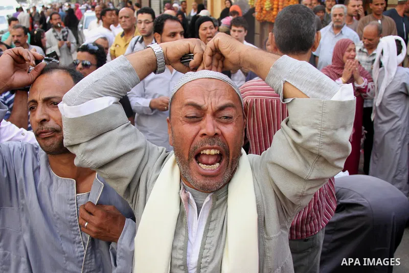 Relatives and families of members of Muslim Brotherhood and supporters of ousted President Mohamed Mursi react after hearing the sentence, in front of the court in Minya, south of Cairo, April 28, 2014. An Egyptian court...