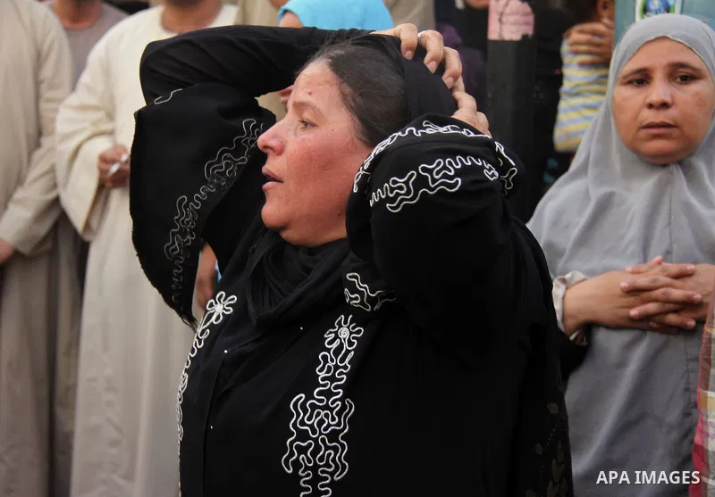 Relatives and families of members of Muslim Brotherhood and supporters of ousted President Mohamed Mursi react after hearing the sentence, in front of the court in Minya, south of Cairo, April 28, 2014. An Egyptian court...