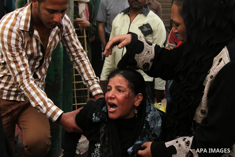 Relatives and families of members of Muslim Brotherhood and supporters of ousted President Mohamed Mursi react after hearing the sentence, in front of the court in Minya, south of Cairo, April 28, 2014. An Egyptian court...