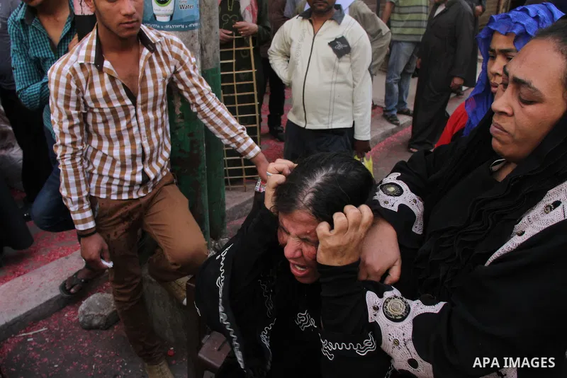 Relatives and families of members of Muslim Brotherhood and supporters of ousted President Mohamed Mursi react after hearing the sentence, in front of the court in Minya, south of Cairo, April 28, 2014. An Egyptian court...
