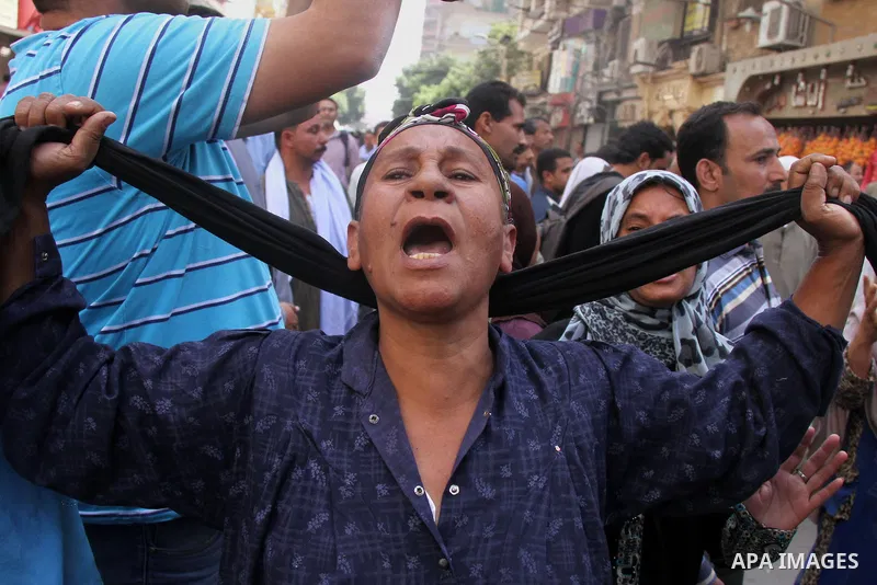 Relatives and families of members of Muslim Brotherhood and supporters of ousted President Mohamed Mursi react after hearing the sentence, in front of the court in Minya, south of Cairo, April 28, 2014. An Egyptian court...