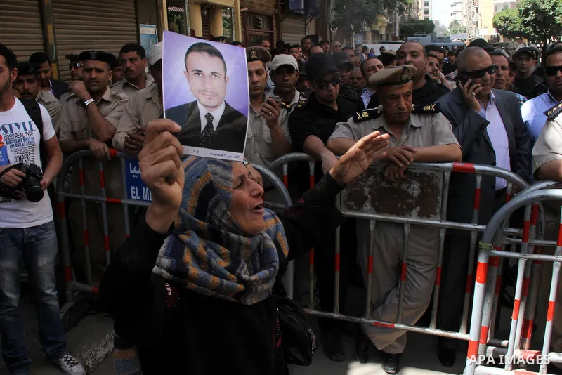 Relatives and families of members of Muslim Brotherhood and supporters of ousted President Mohamed Mursi react after hearing the sentence, in front of the court in Minya, south of Cairo, April 28, 2014. An Egyptian court...