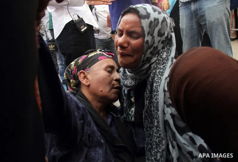 Relatives and families of members of Muslim Brotherhood and supporters of ousted President Mohamed Mursi react after hearing the sentence, in front of the court in Minya, south of Cairo, April 28, 2014. An Egyptian court...